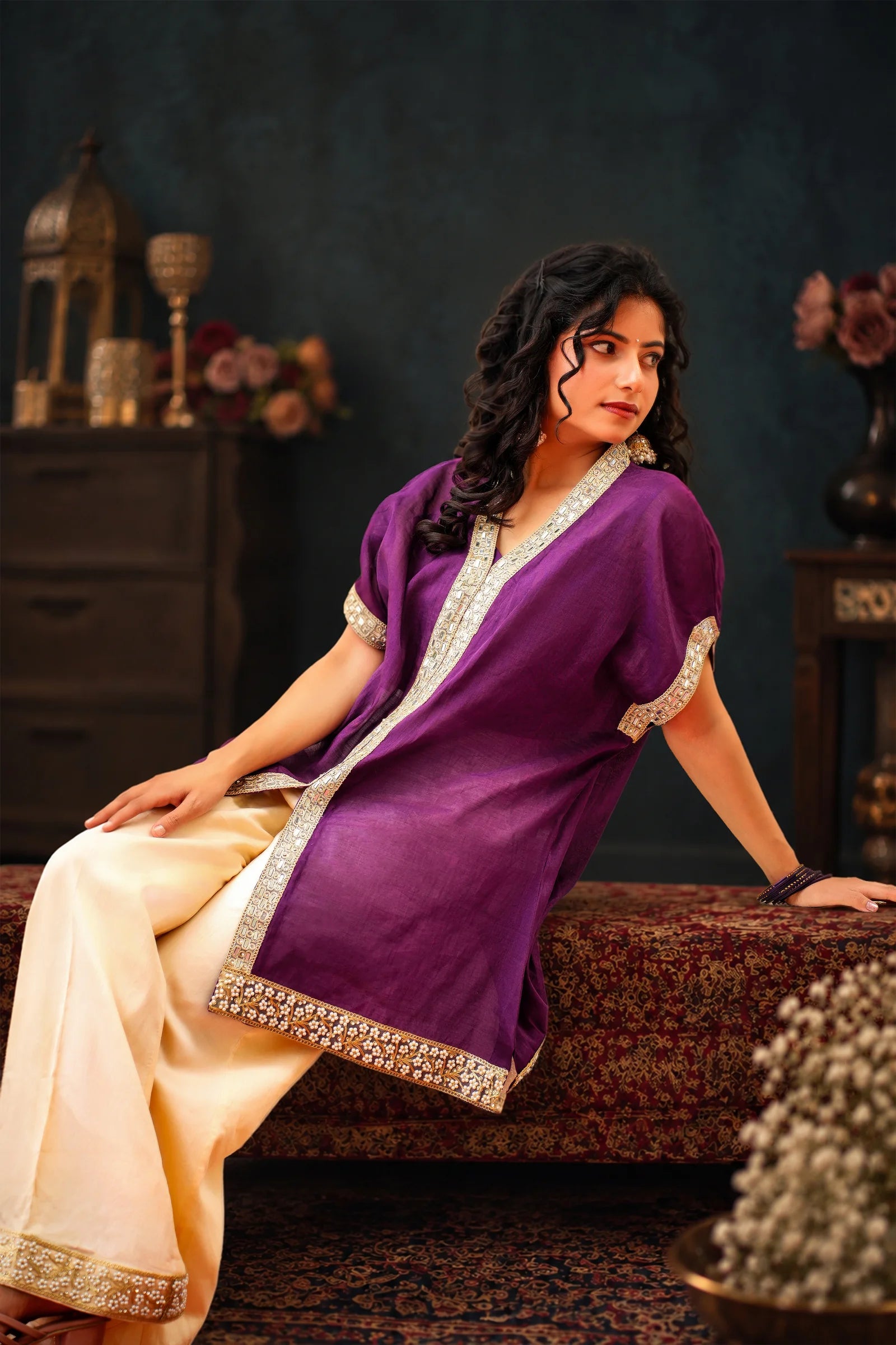 Kachnar violet kaftan and cream palazzo from Dhoop Chaaun Festive ’26, styled in a festive interior